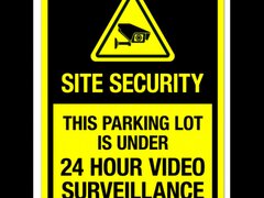 Sign site security this parking lot is under 24 hour video surveillance
